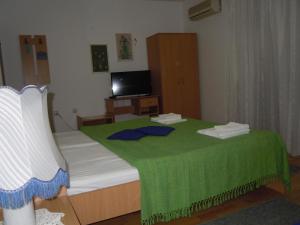 Postel nebo postele na pokoji v ubytování Apartmani Sobe BILJANA