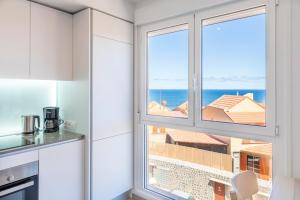 Kuchyň nebo kuchyňský kout v ubytování MEDANO4YOU Vitamin Sea Penthouse
