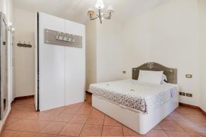 A bed or beds in a room at When in Trastevere