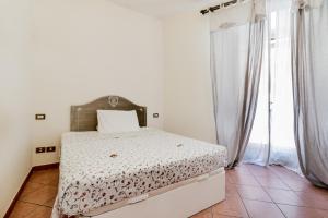 A bed or beds in a room at When in Trastevere