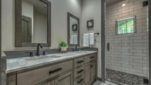 a bathroom with two sinks and a shower at Whitetail Bluff in Mineral Bluff +28 photos