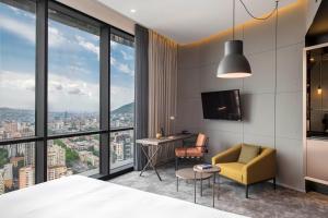 A television and/or entertainment centre at Pullman Tbilisi Axis Towers