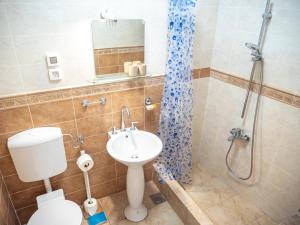 a bathroom with a toilet and a sink and a shower at ~Melody Room ~ with Breezy & Silent Ambience in Hvar
