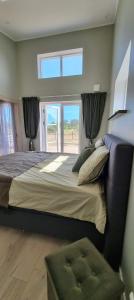 Säng eller sängar i ett rum på Trevlig fritidshus på Norra Öland
