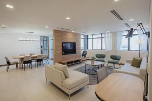 TV i/ili multimedijalni sistem u objektu Novotel Living Singapore Orchard