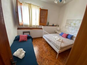 Postel nebo postele na pokoji v ubytování La Casa sulla Spiaggia: Dimora Elma