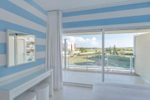 a room with a large window with a view at Laguna - Vilamoura in Vilamoura