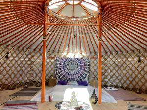 a room with a bed in a yurt at Jurta pod Blaníkem 