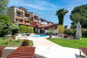 a villa with a swimming pool and a resort at Apartments with Pool Villa Rossella 1 in Rovinj