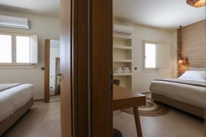 Cama ou camas em um quarto em Life Suites
