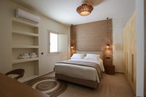 Cama ou camas em um quarto em Life Suites