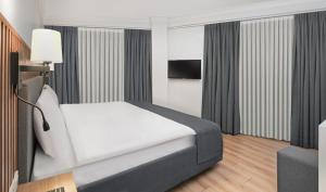 Postel nebo postele na pokoji v ubytování Silvana Hotel