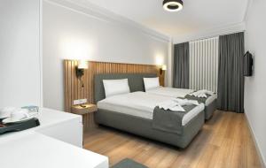 Postel nebo postele na pokoji v ubytování Silvana Hotel