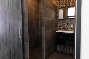 a bathroom with a shower and a sink at Hotel Monnickendam in Monnickendam