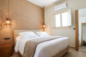 Cama ou camas em um quarto em Life Suites