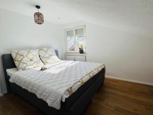 Postel nebo postele na pokoji v ubytování Allgäu SPA House
