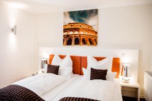 Un pat sau paturi într-o cameră la Hotel Gut Landscheid