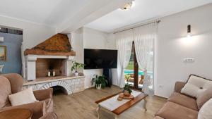 Μια τηλεόραση ή/και κέντρο ψυχαγωγίας στο Villa Campagna by Villas Holiday