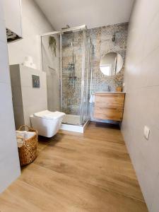 a bathroom with a shower and a toilet and a sink at MR HOME APARTMENTS - Limba in Kraków