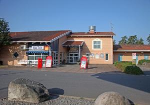 a building with two big rocks in front of it at Rasta Eksjö in Eksjö