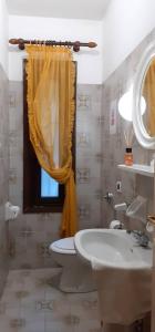 a bathroom with a sink and a toilet and a window at Miralago View in Revine Lago +71 photos