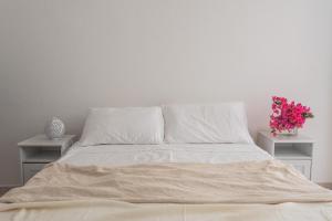 A bed or beds in a room at Villa Patrizia