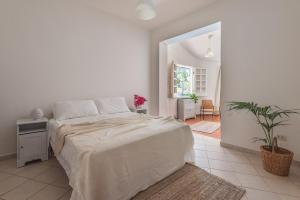 A bed or beds in a room at Villa Patrizia