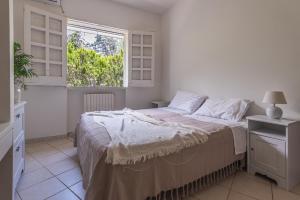 A bed or beds in a room at Villa Patrizia