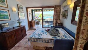 A bed or beds in a room at La Pianotta Sulla Spiaggia