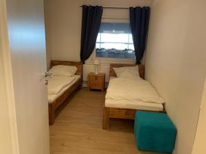 Postel nebo postele na pokoji v ubytování Idylle auf dem Reiterhof bei Husum