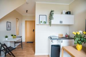 a kitchen and living room with a table and chairs at Alte Feuerwache in Berlin