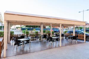 Reštaurácia alebo iné gastronomické zariadenie v ubytovaní Hotel Olympia Ronda I