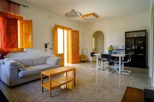 a living room with a couch and a table at Dimore Tarantini in Polignano a Mare