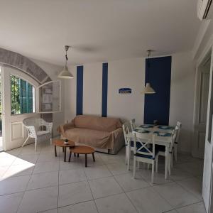 a living room with a couch and a table at Villa Allegra in Lovran