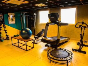 a gym with a treadmill and a exercise bike at Ibis Mossoro in Mossoró