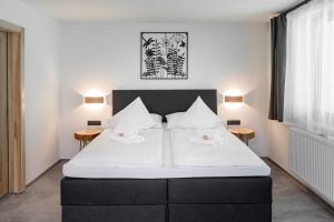 Postel nebo postele na pokoji v ubytování Wellness aparthotel Martiňák