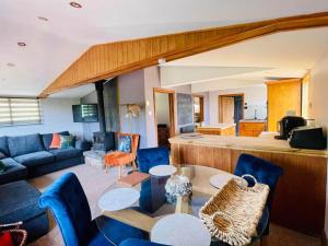 a living room with a couch and a table at Mountain View Lodge in Ludlow