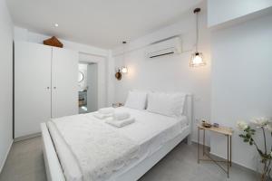 Postel nebo postele na pokoji v ubytování Korina's Suites