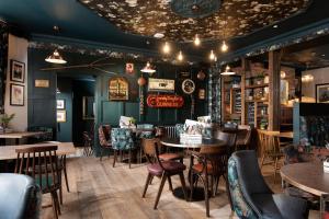 a dining room with tables and chairs at The Northallerton Inn - The Inn Collection Group in Northallerton