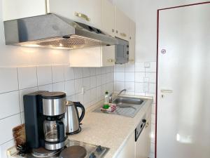 Kuchyň nebo kuchyňský kout v ubytování Hafenresidenz - Ferienwohnung 31