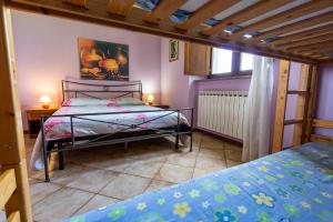 Säng eller sängar i ett rum på L'Olmo di Casigliano