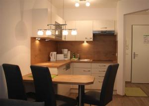 Haus Meeresblick - Ferienwohnung Strandkrabbe A 3.16 (Ref. 159955)にあるキッチンまたは簡易キッチン