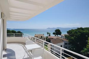 a balcony with a view of the ocean at Hotel Ivory Playa Sports & Spa in Port d'Alcudia