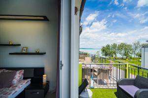 A balcony or terrace at Andante Panoráma Apartman