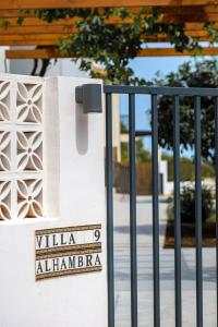 a gate with a sign that reads villa alhambra behind it at Luxury Villa Alhambra Private Pool close to Sea and Centre in Benalmádena