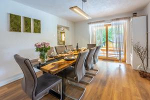 a dining room with a table and chairs at Holiday Home Mali Medo in Gospić