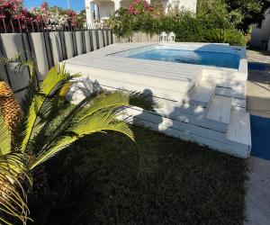 a swimming pool in a yard next to a fence at La Bicocca di Annavì in Forio d'Ischia