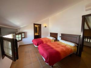a room with two beds and a mirror at VILLA BRISA DE LA ANTILLA in La Antilla +18 photos