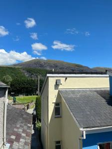 a view from the roof of a house with a mountain in the background at 4-6 Guests in centre location with stunning views in Llanberis