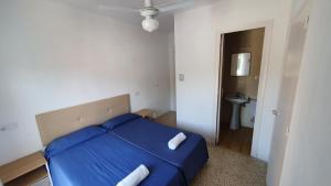 Postel nebo postele na pokoji v ubytování Hostal Cruz